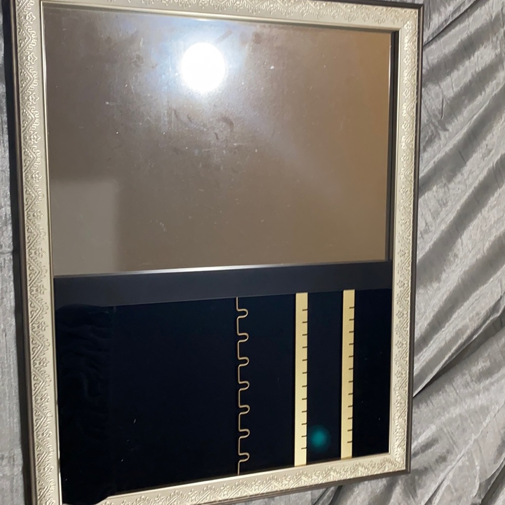 Mirror that holds jewelry